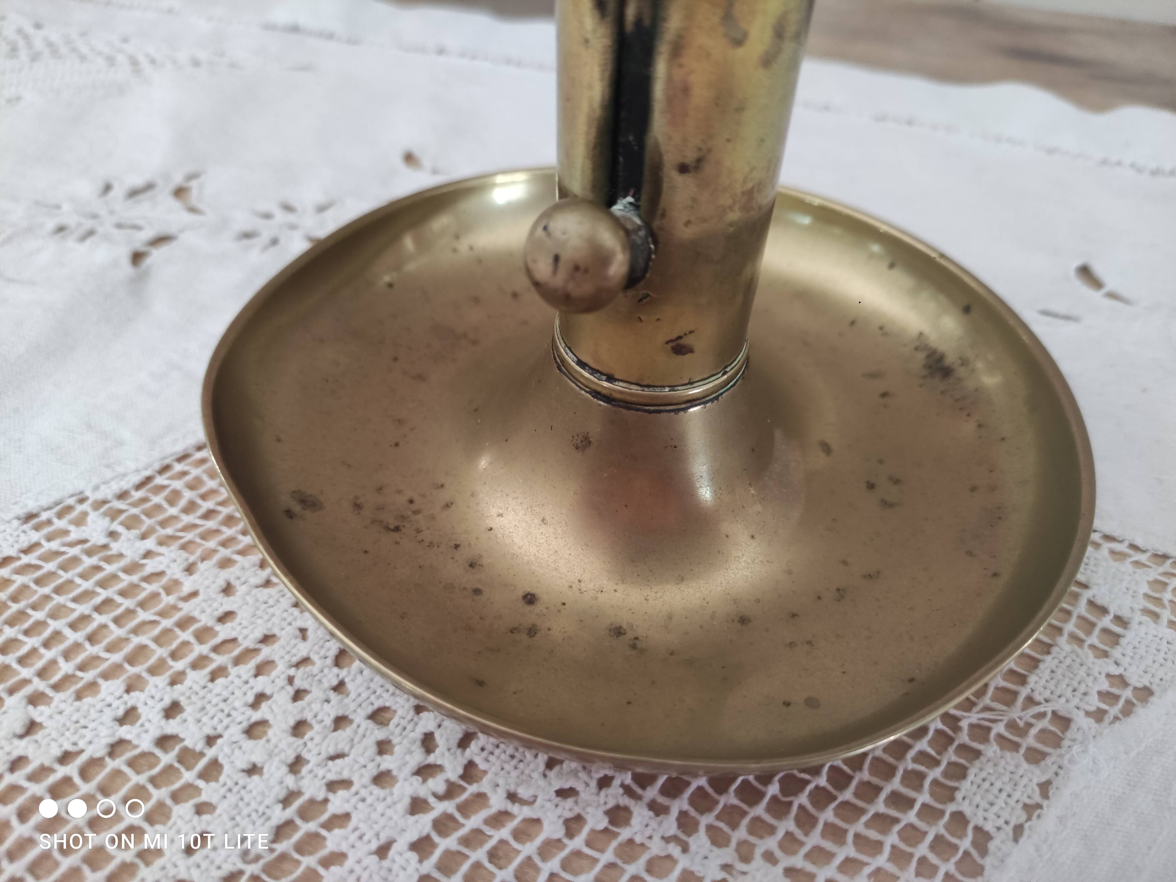 Brass push candle holder on frame