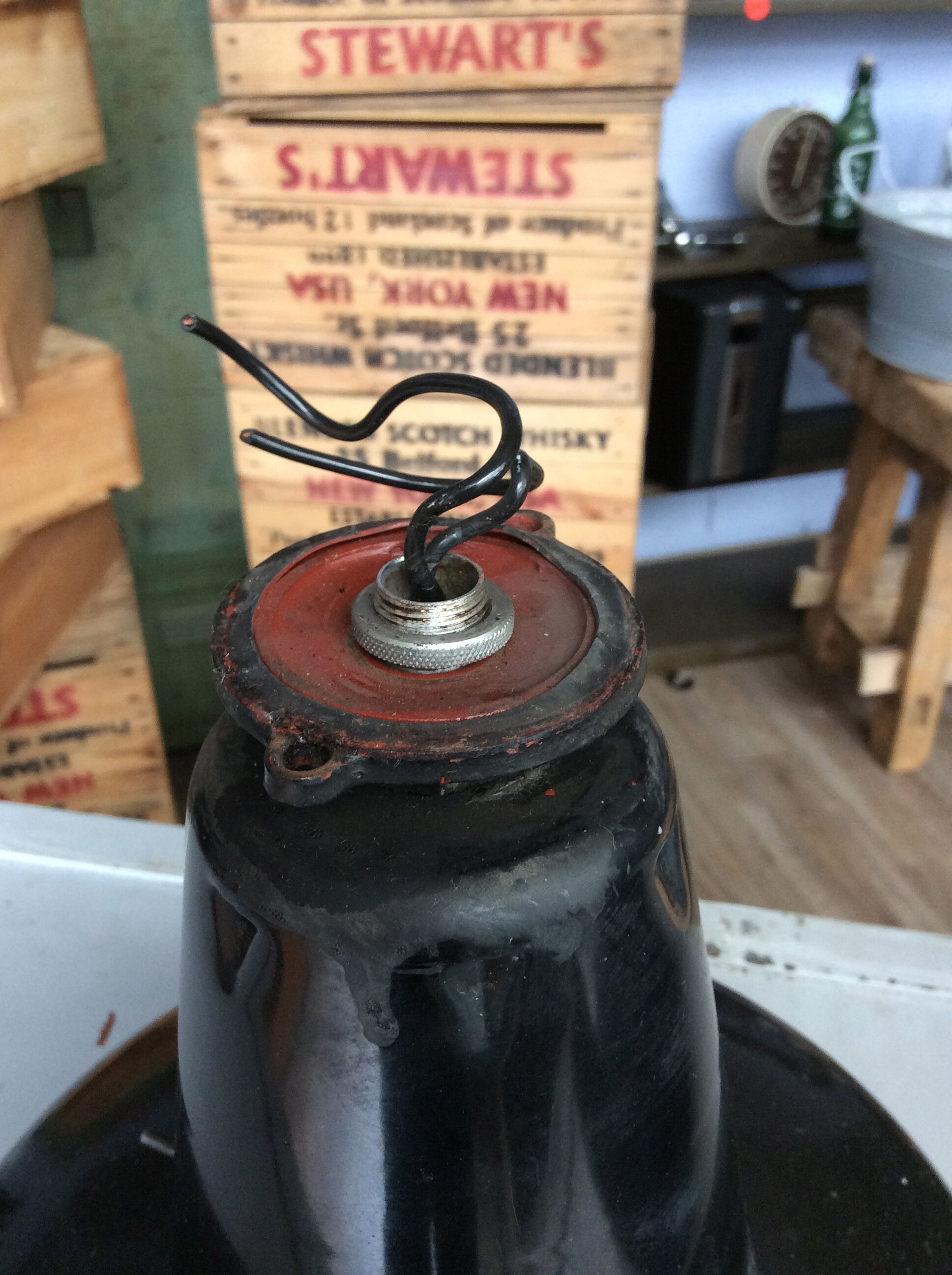 Hanging reflectolux mazda in black enamelled sheet metal.