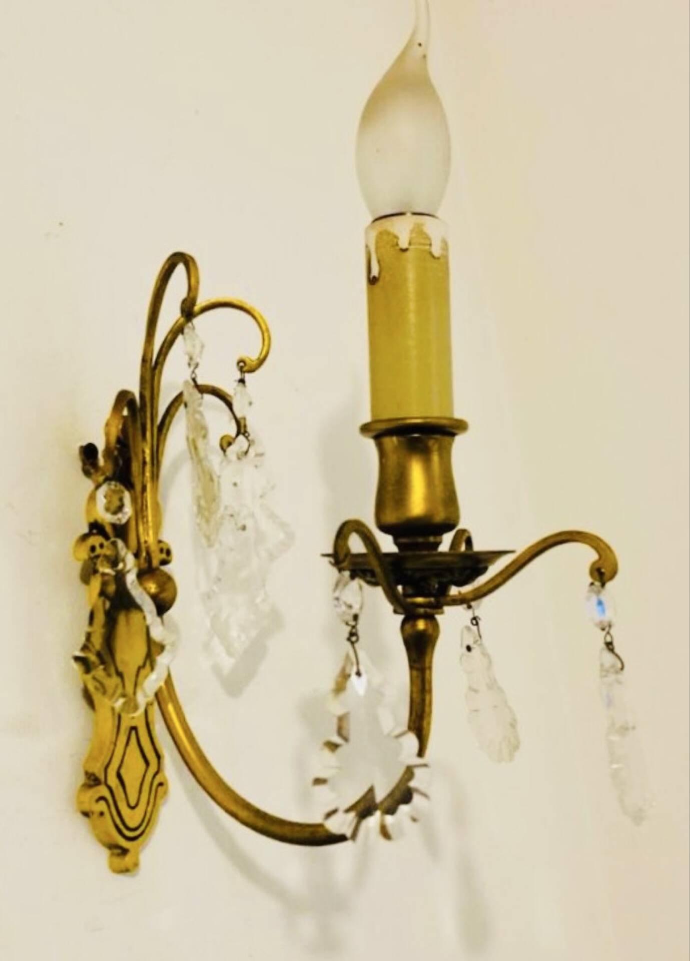 Brass wall light with glass pendants from the mid-20th century.