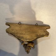 Antique wall-mounted console in gilded wood in rococo style.