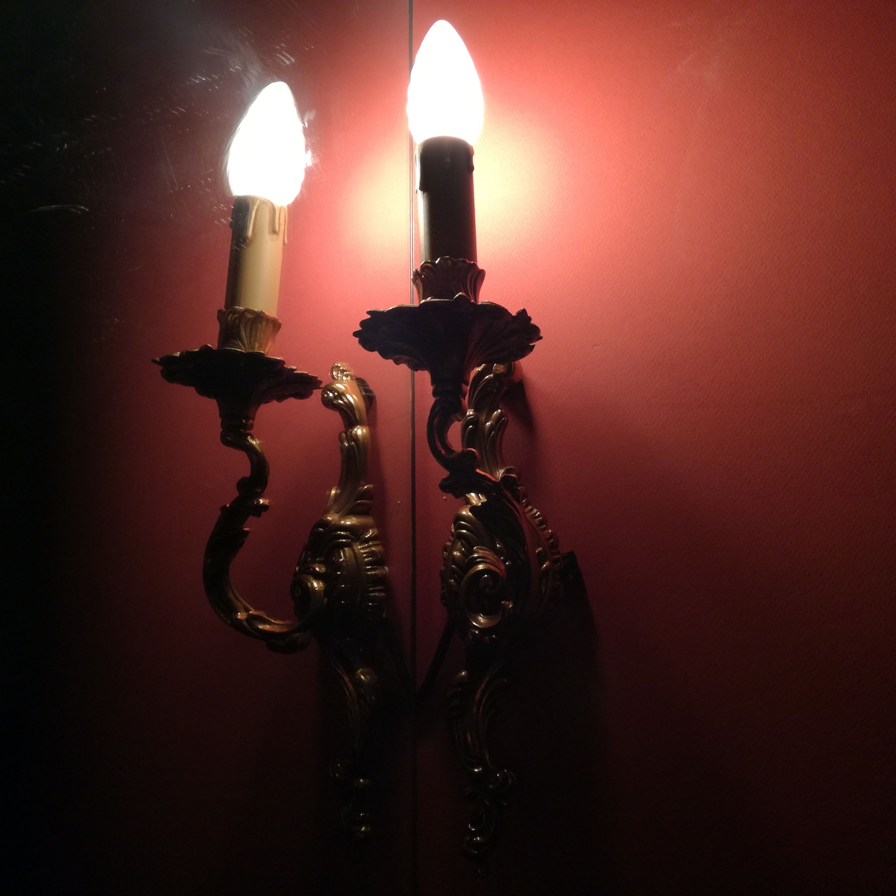 Pair of Louis XV wall lamps in bronze