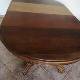 Old table with central leg, small casters, 2 extensions