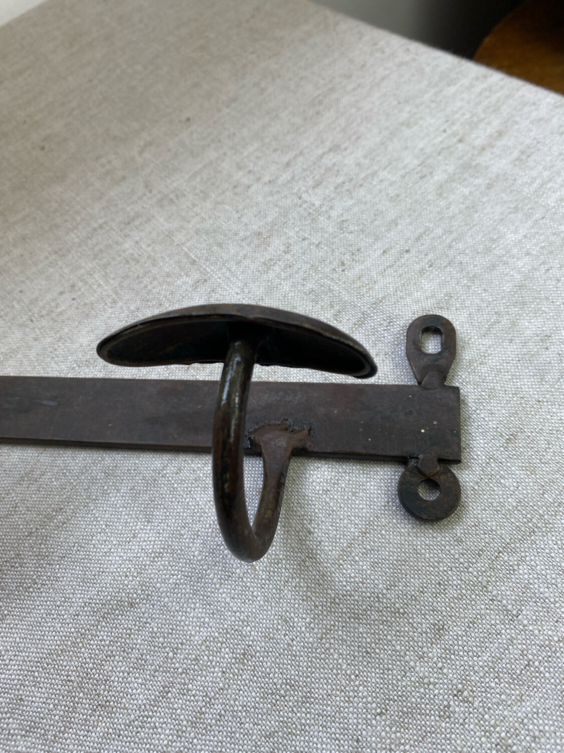 Coat rack, four hooks, in wrought iron.