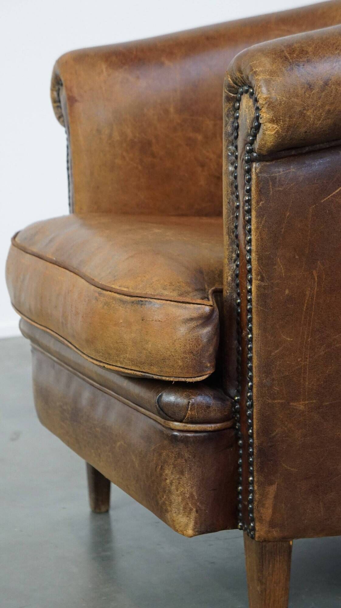Characterful sheepskin leather club armchair with a luxurious, rustic appearance