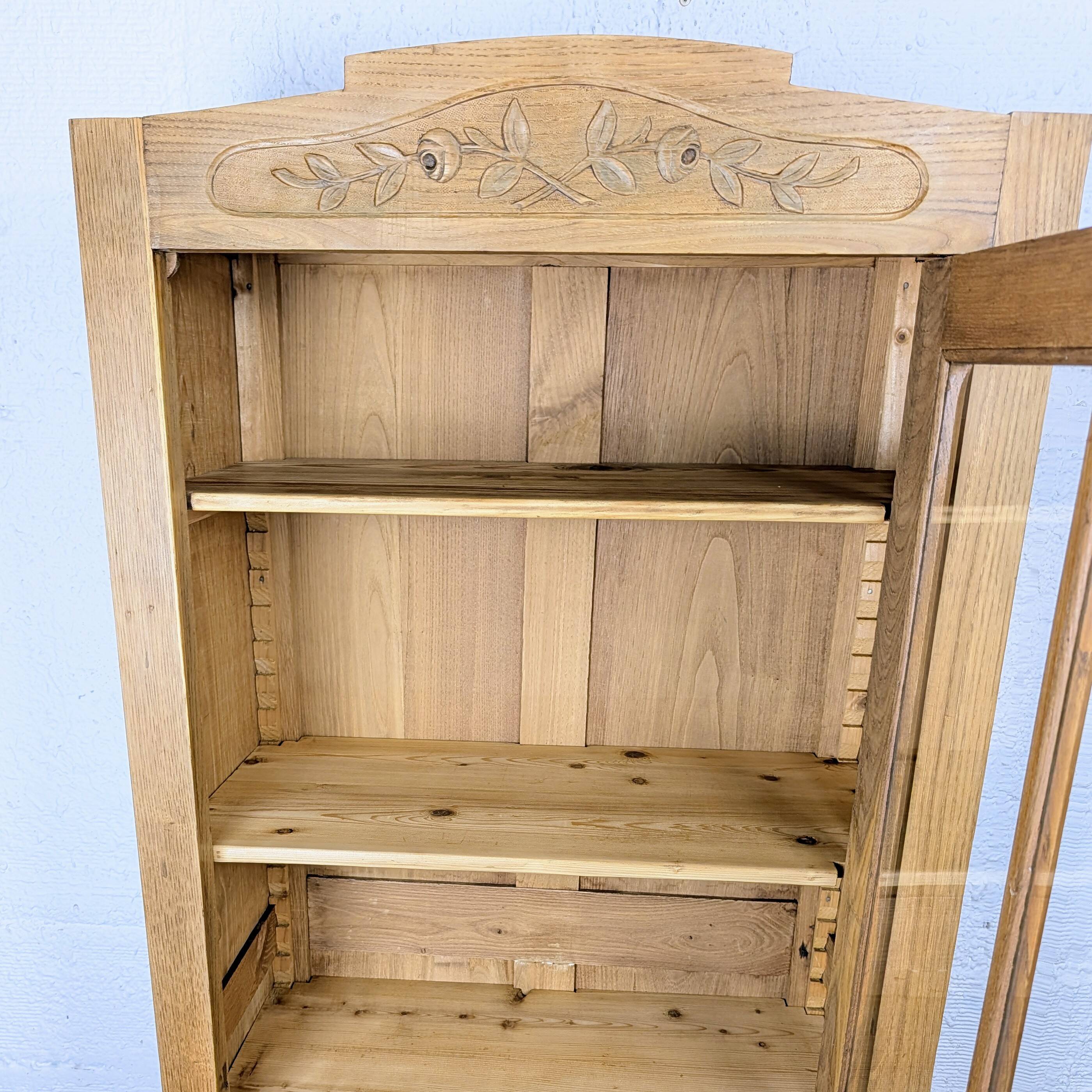 Glass-fronted cabinet from the 1930s-1940s.