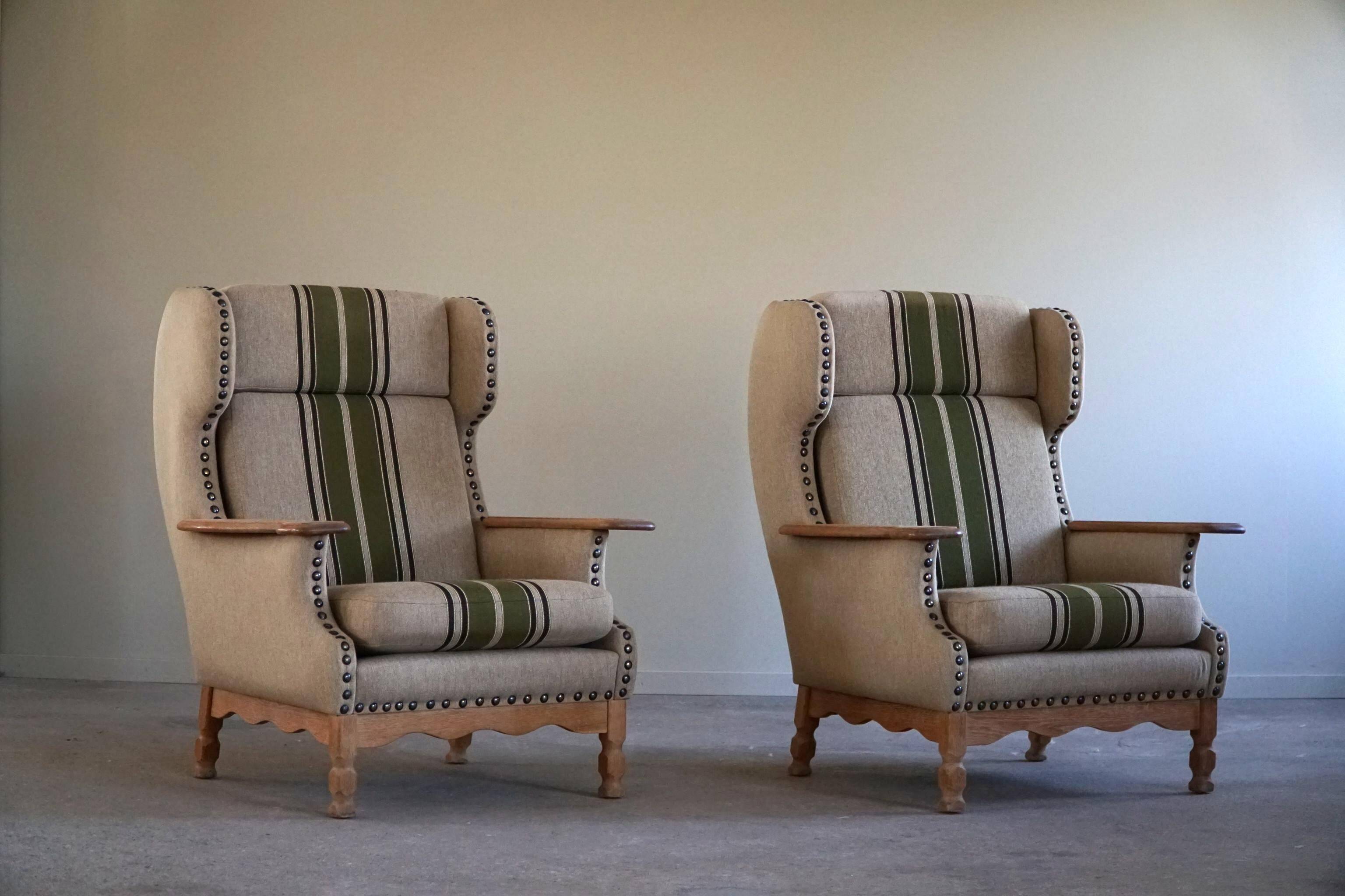 Pair of high-back lounge chairs in modern Danish style in the manner of Henning Kjærnulf, 1960s.