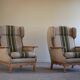 Pair of high-back lounge chairs in modern Danish style in the manner of Henning Kjærnulf, 1960s.