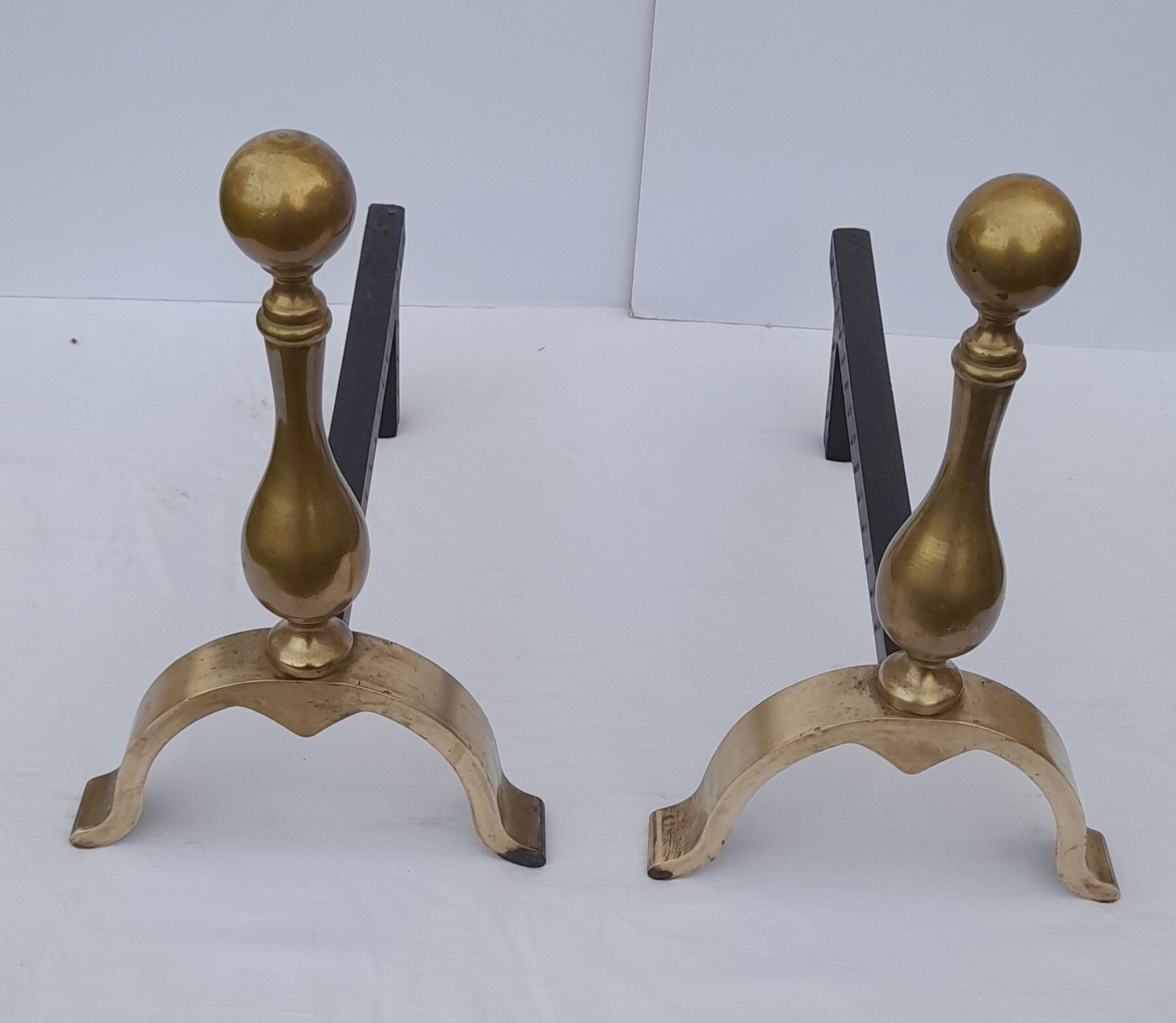 Pair of brass and black wrought iron chenets