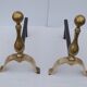 Pair of brass and black wrought iron chenets