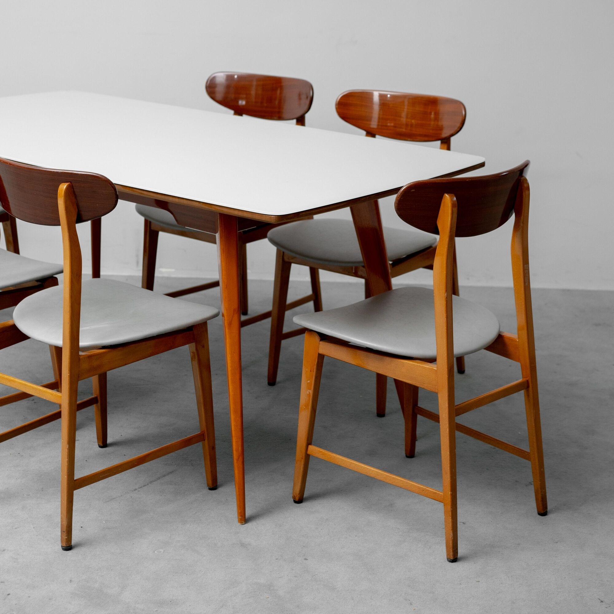 Vintage dining table set with 6 wooden chairs from the 1960s modernism