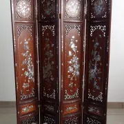 Asian screen in carved wood and mother-of-pearl marquetry.