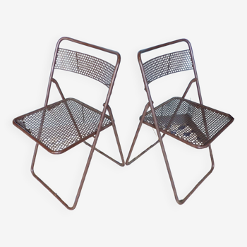 Pair of folding chairs in perforated sheet metal