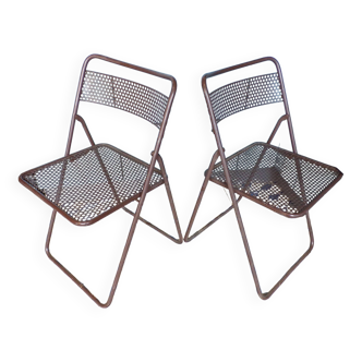 Pair of folding chairs in perforated sheet metal