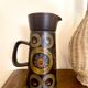 Enamelled ceramic carafe