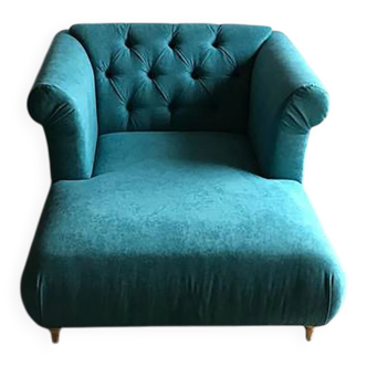 Mid-century turquoise blue fabric sofa with solid oak legs and tufting.