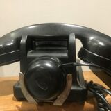 Black bakelite dial telephone with support