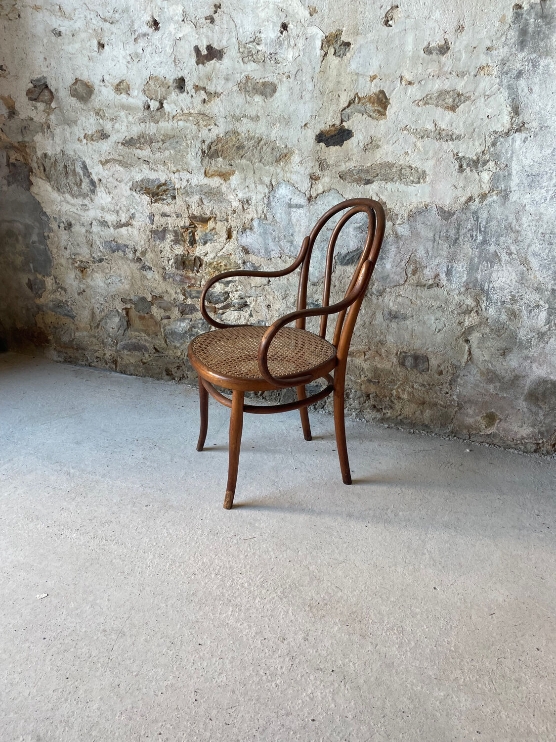Thonet armchair with bent wood and caning