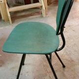 Chair in curved wood covered with vinyl, metal tube.