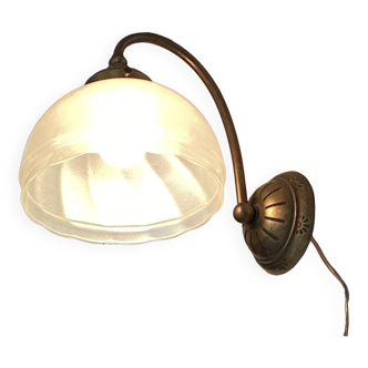 Brass wall light with a glass globe dimension: height -21cm- width -27cm-