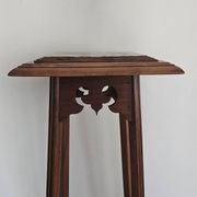 High plant stand in carved wood and Art Nouveau marble.