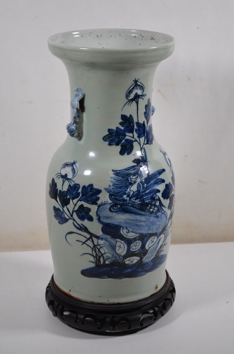 China. Porcelain mallet vase with blue and white phoenix decoration on a rock.