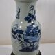 China. Porcelain mallet vase with blue and white phoenix decoration on a rock.