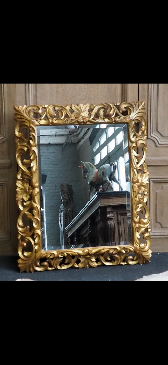 Superb mirror from the late 19th century, carved wood with gilded stucco.