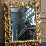 Superb mirror from the late 19th century, carved wood with gilded stucco.