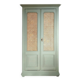 Caned cabinet with oranges