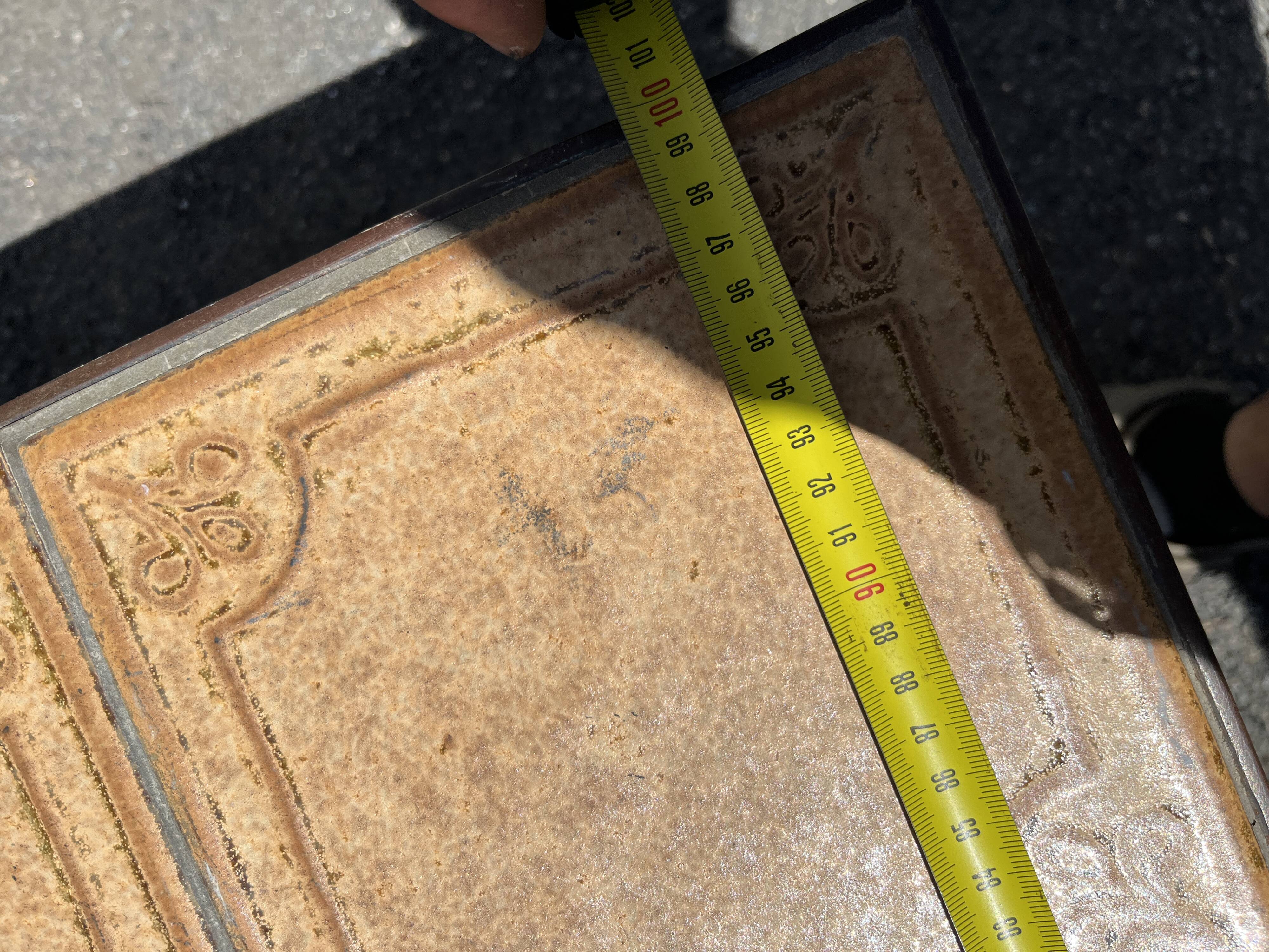 Vintage garden table with ceramic tile top and wrought iron base