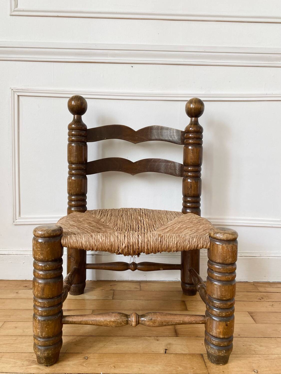 Low fireplace chair in the style of Charles Dudouyt