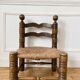 Low fireplace chair in the style of Charles Dudouyt
