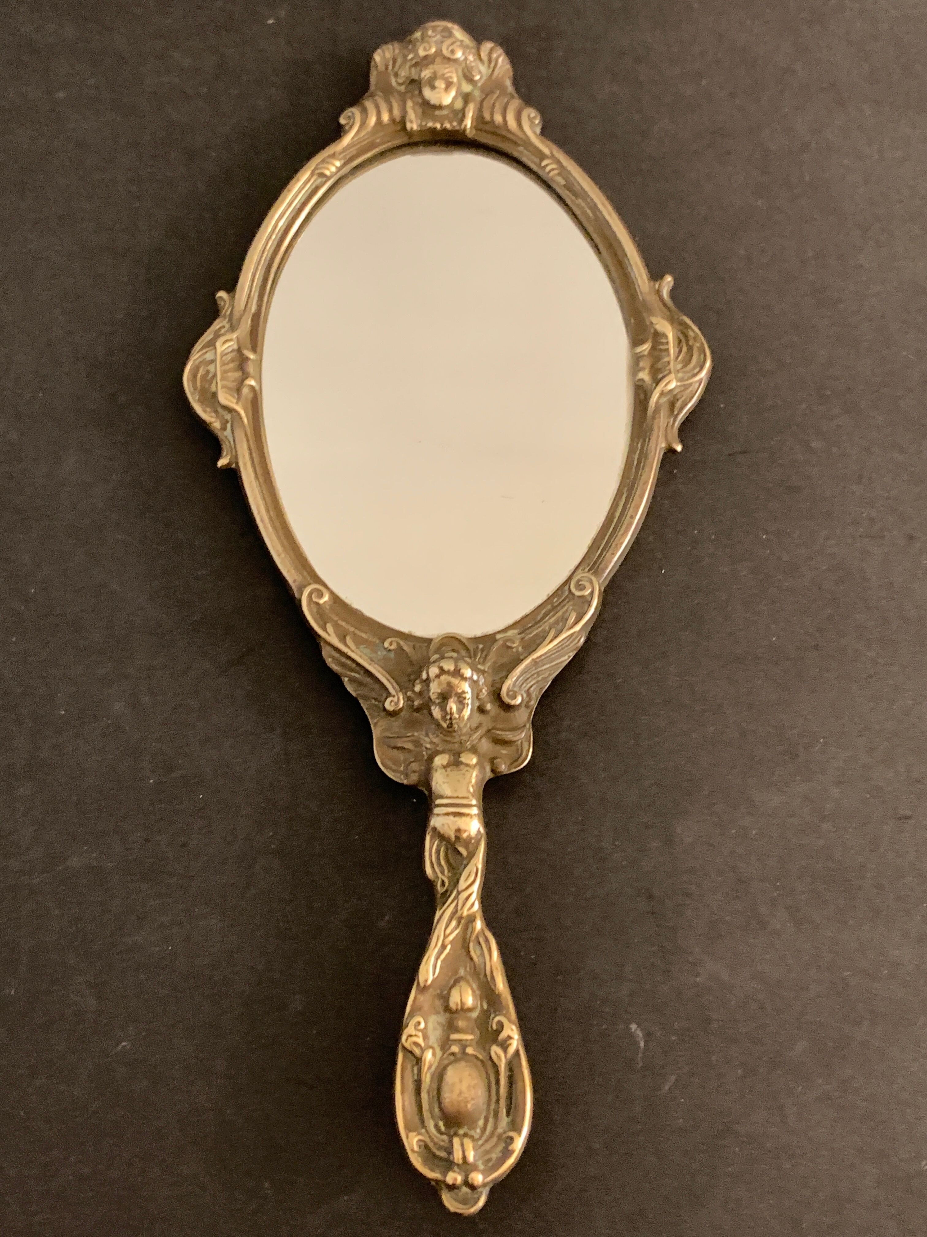 Bronze hand-facing mirror, early twentieth century, Louis XV style, 29 x 13 cm