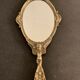 Bronze hand-facing mirror, early twentieth century, Louis XV style, 29 x 13 cm