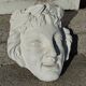 Old face in plaster antique decoration