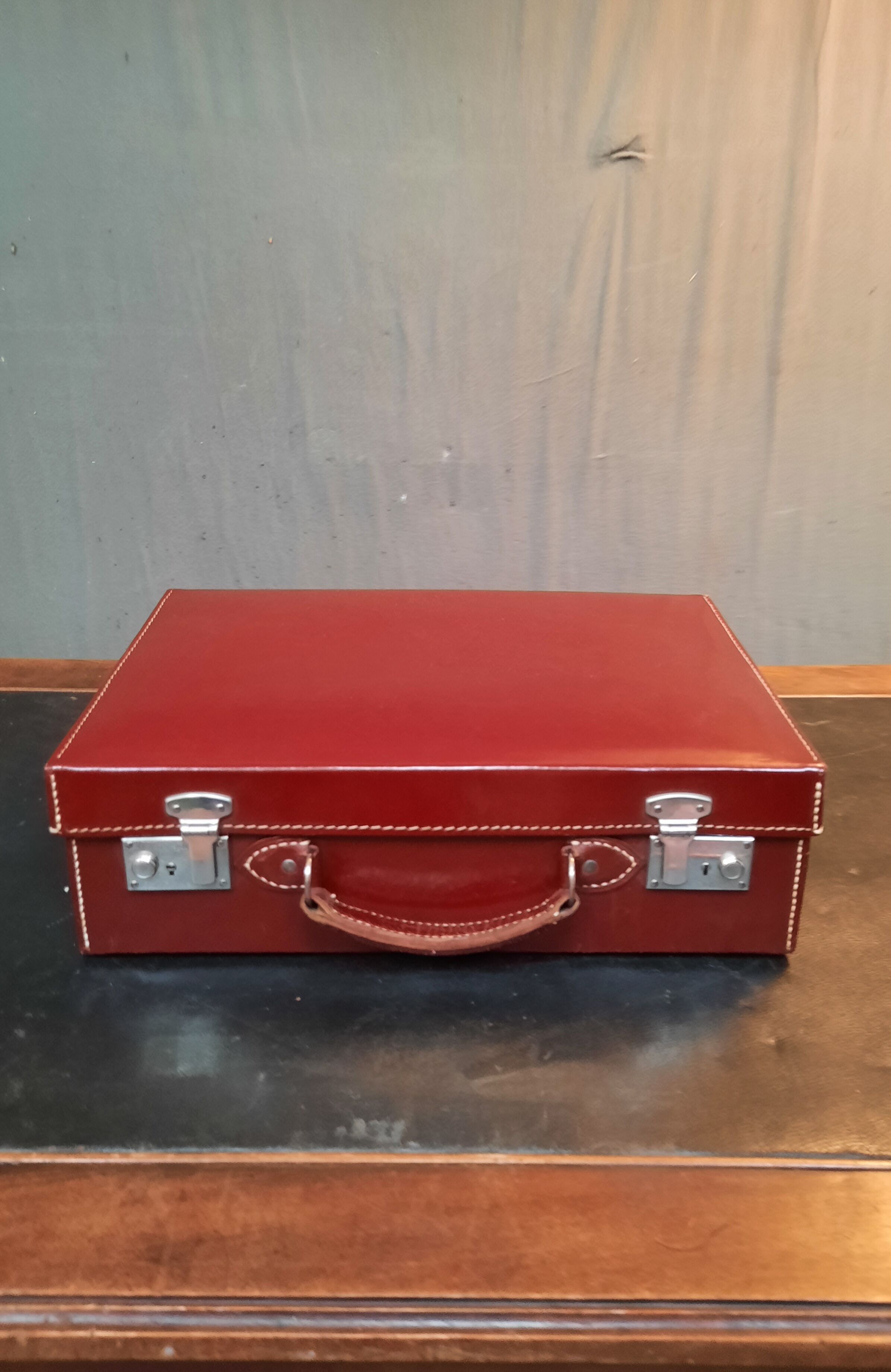 Red leather suitcase
