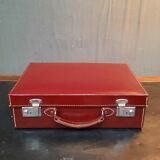 Red leather suitcase
