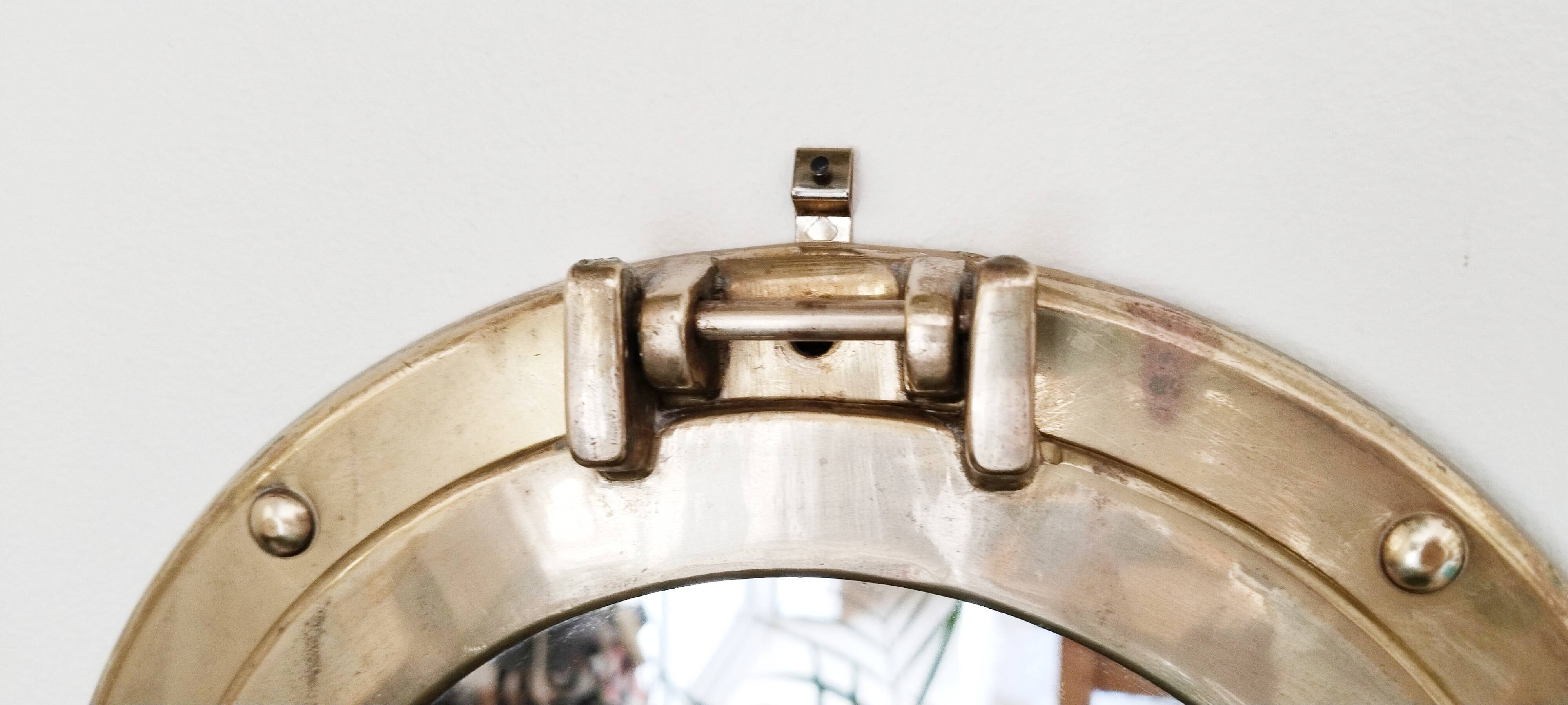 Porthole mirror in gilded brass, marine mirror