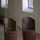 Pair of Swedish folk art stump chairs, decorated with painted floral motifs, late 19th century.