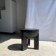 Black mango wood tripod side table with a semi-spherical top, height: 45 cm, diameter: 44 cm.