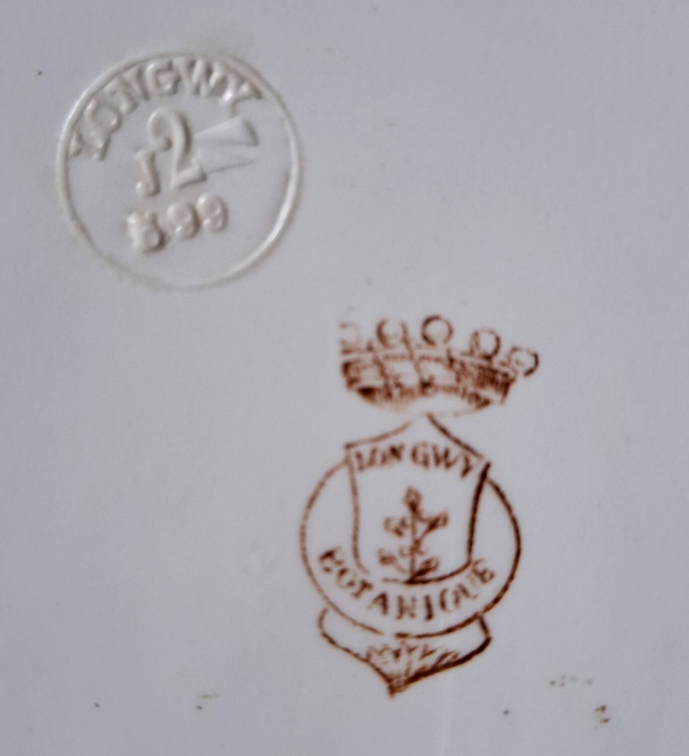 Antique iron earthenware plates accompanied by dishes