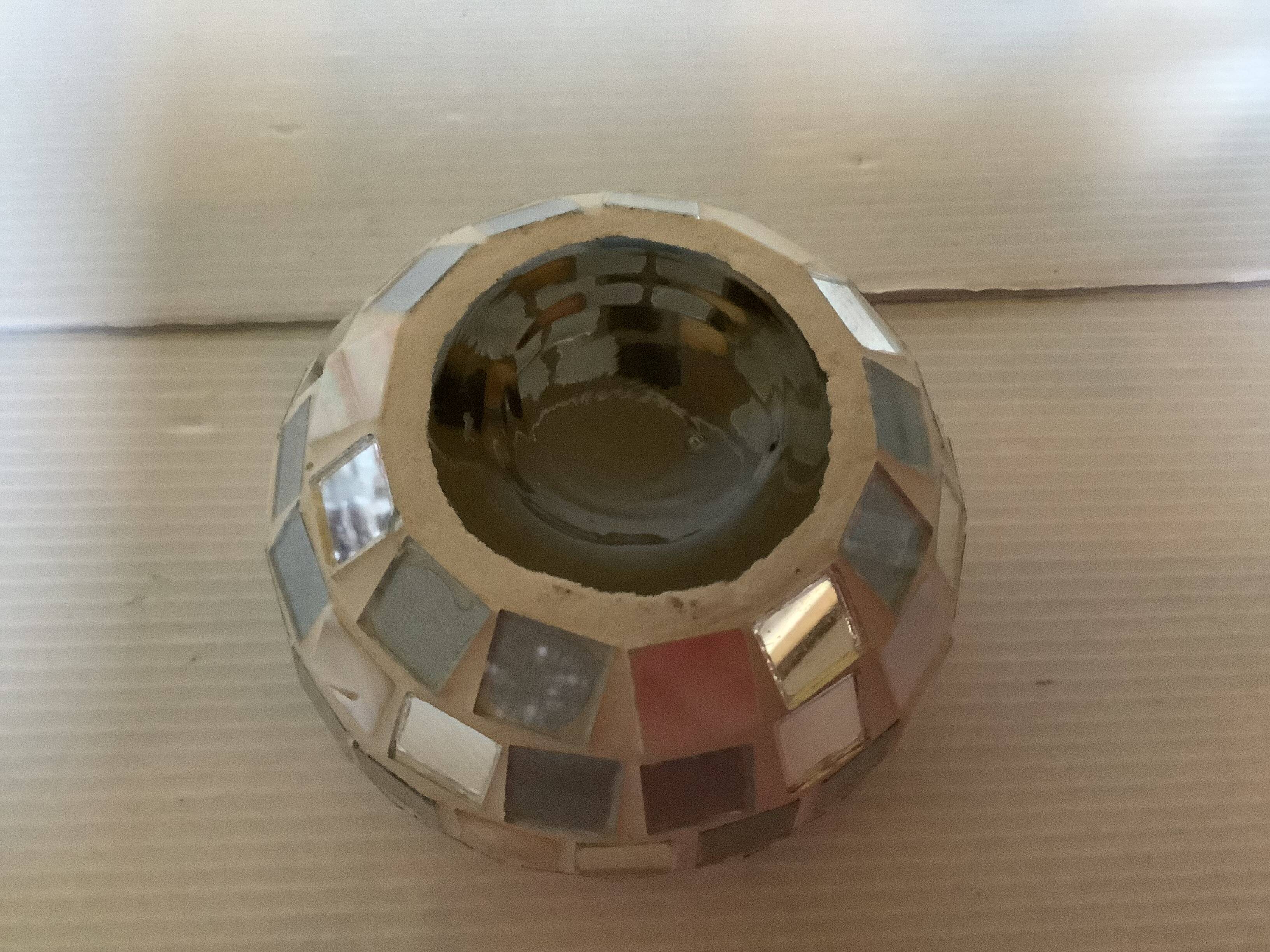 Four mosaic mirror and mother-of-pearl candle holders.