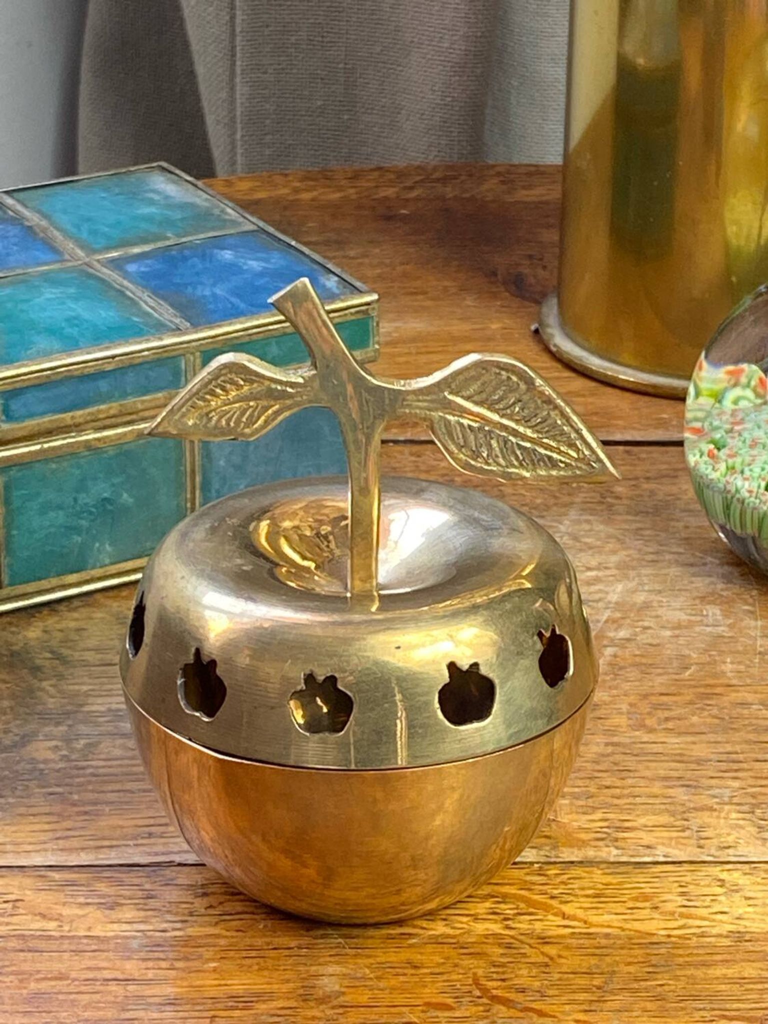 Bonbonnière, in the shape of an apple, made of brass.