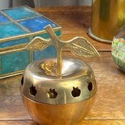 Bonbonnière, in the shape of an apple, made of brass.