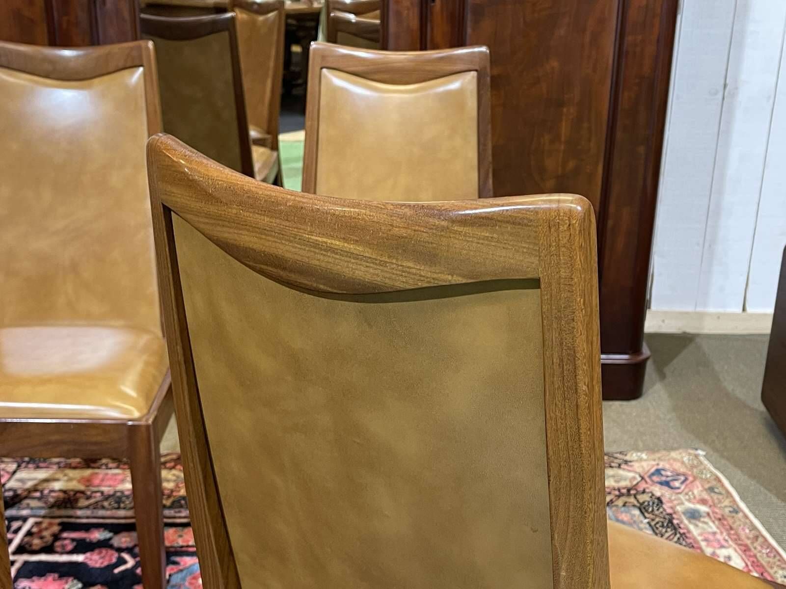 Set of 4 G-Plan chairs in teak and faux leather from the 1970s.