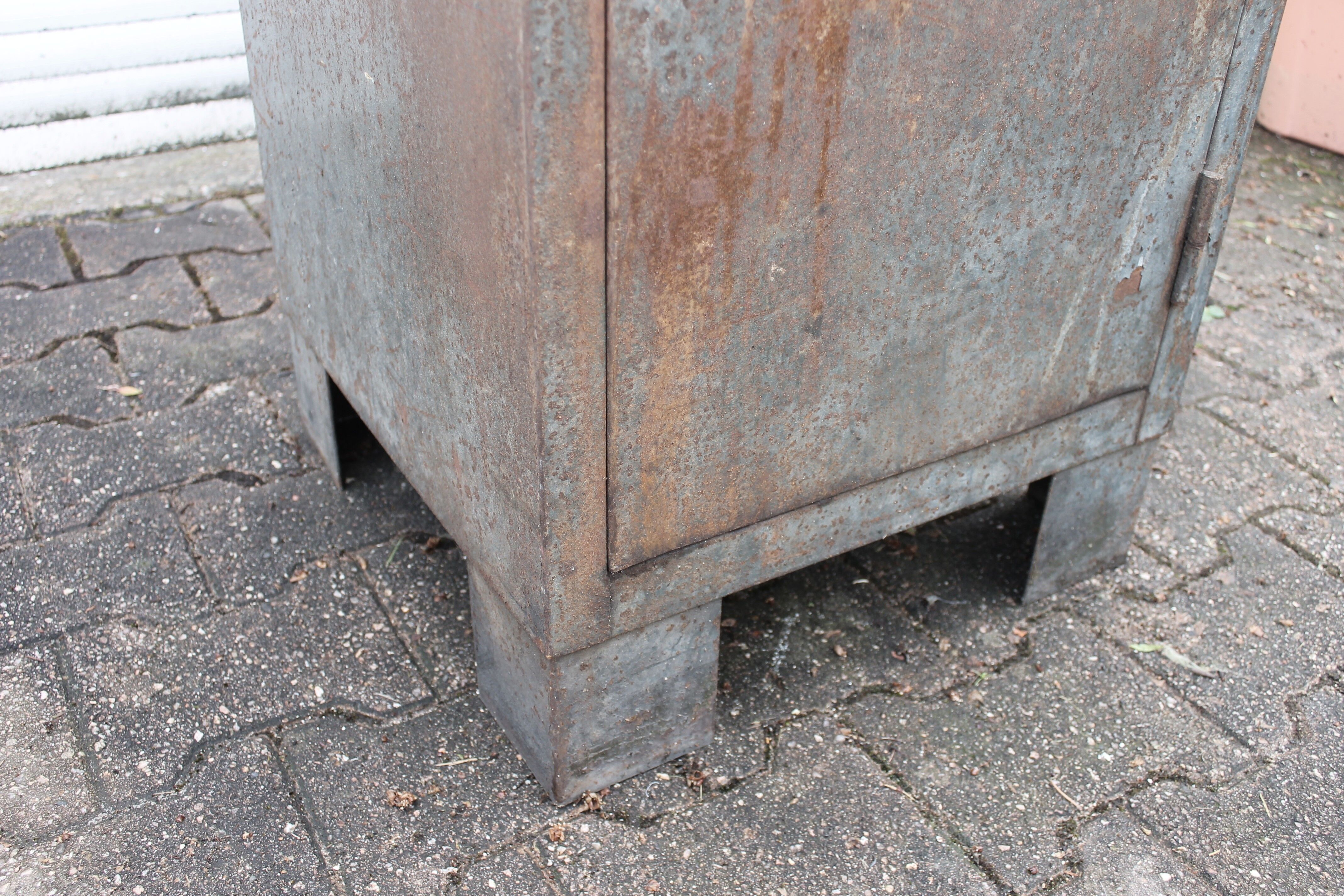 Grey industrial metal cabinet to be restored