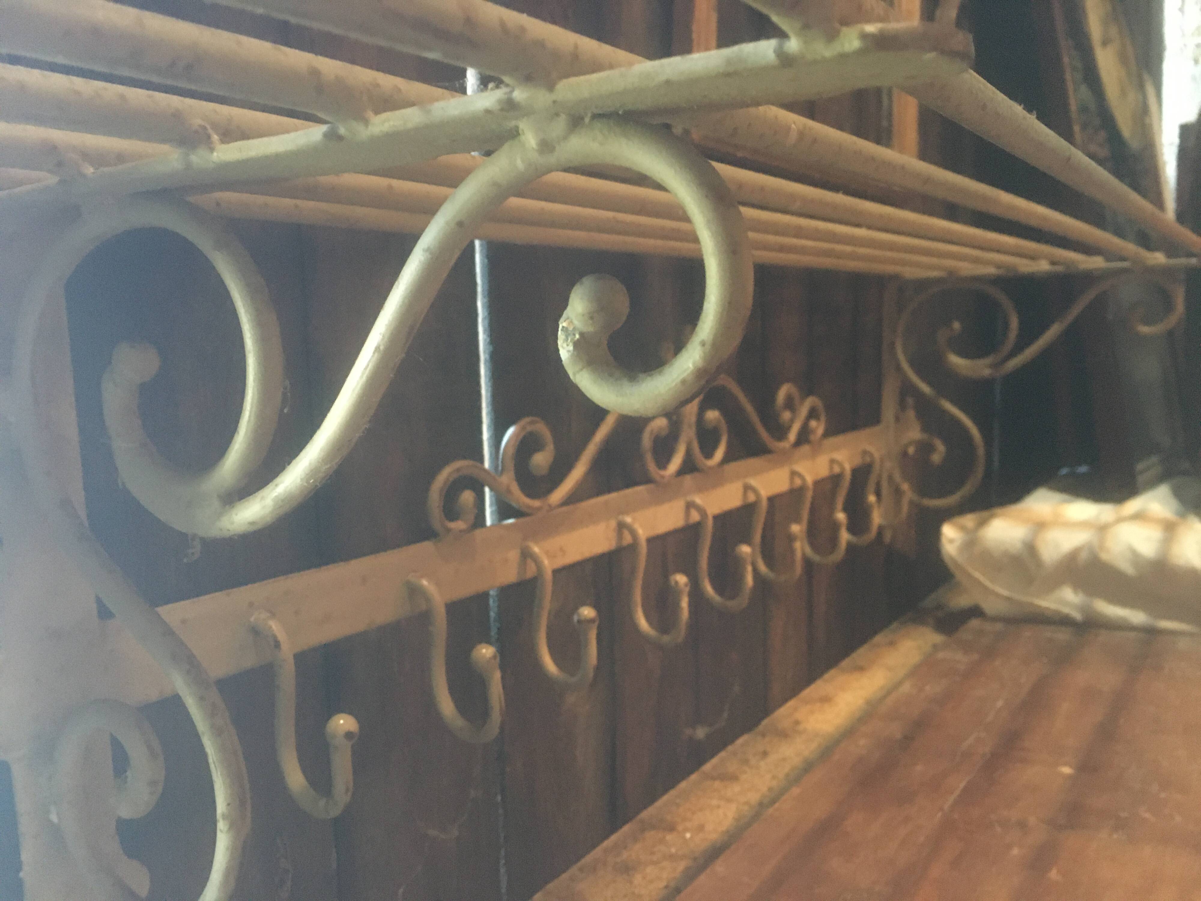 White wrought iron coat and hat rack