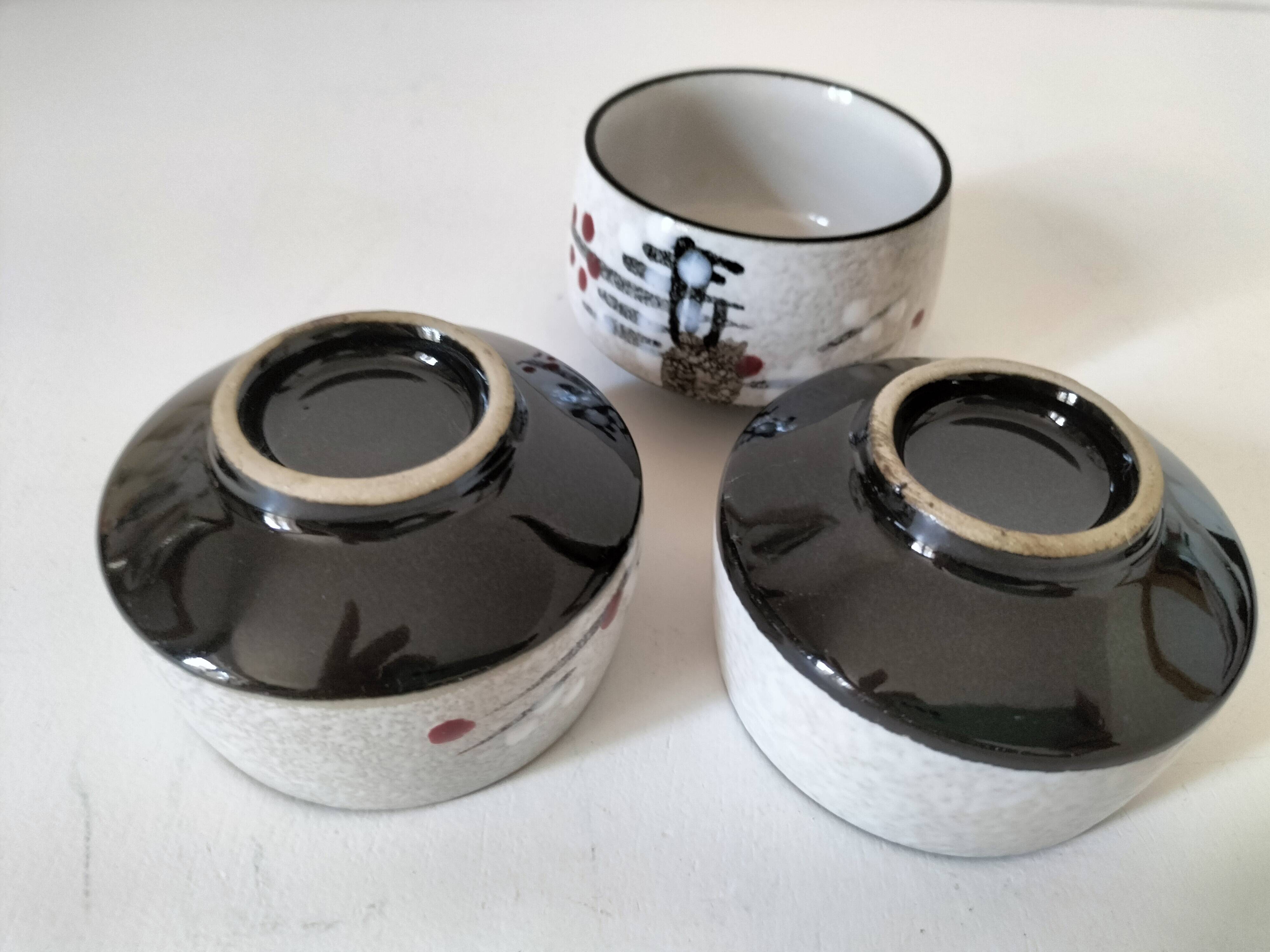 Three glazed ceramic bowls with raised graphic decoration, 1970s.