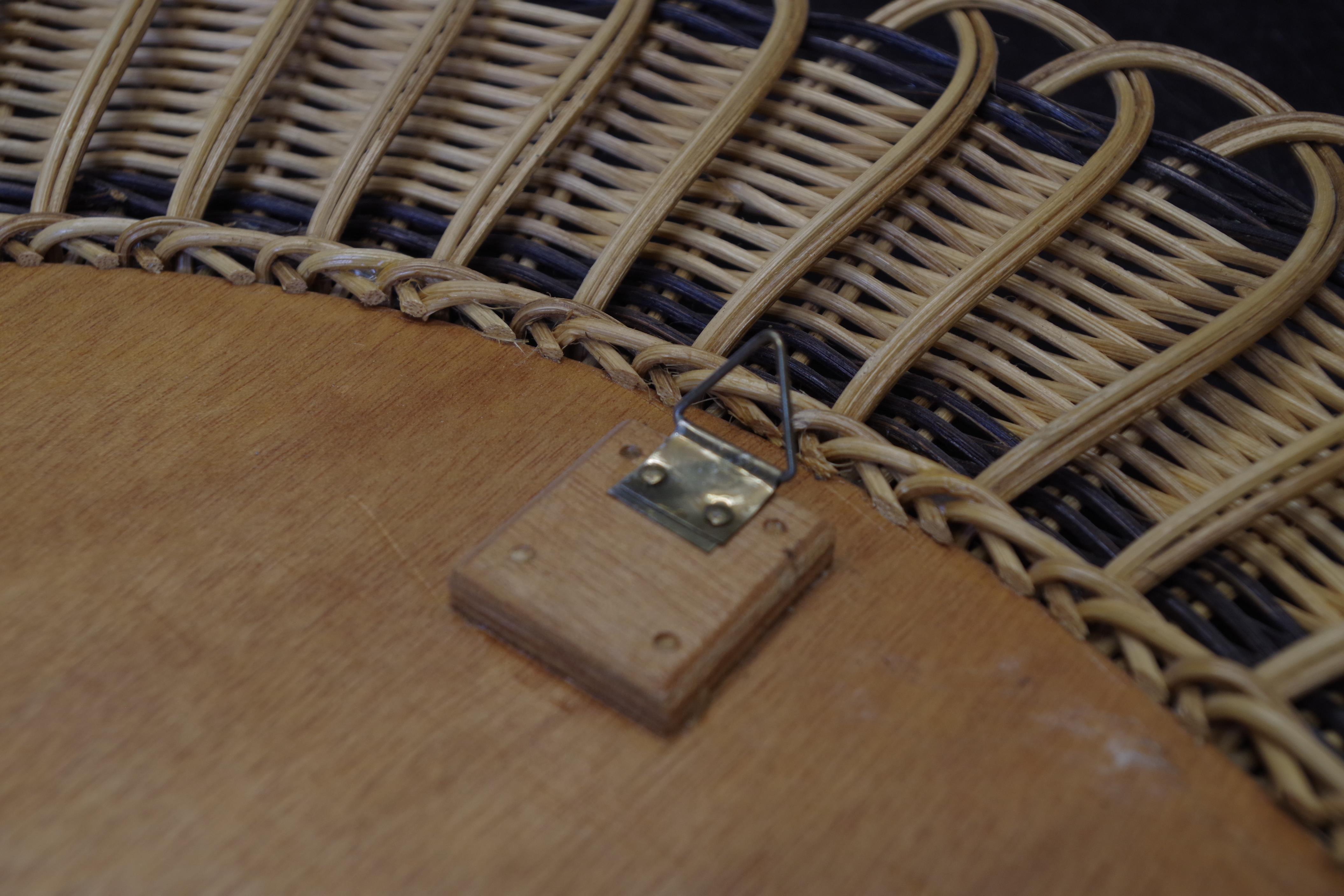 Vintage round mirror in a wicker frame