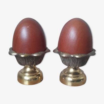 Pair of brass cockroaches with wooden eggs